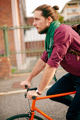 Buy stock photo Commute, bicycle or man cycling in city for eco friendly transport, travel or entrepreneur. Morning, thinking or designer on road in urban town with bike, fashion or confidence for creative career