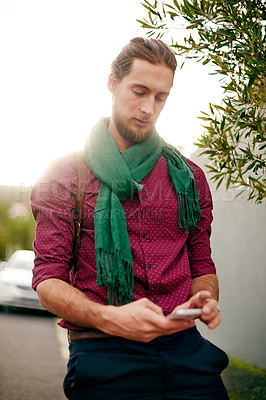 Buy stock photo Search, texting or man with phone in street for social media post, commute and city travel. Outdoor, morning or male designer in urban town with location, mobile app or address for online directions