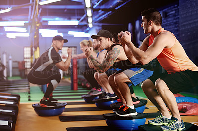 Buy stock photo Fitness, group and squats on bosu ball at gym for core strength, instructor guidance or exercise. Stability, man or personal trainer with balance on equipment for glutes development or technique help