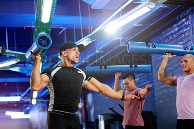 Buy stock photo Coach, lifting and people with equipment for training lesson, shoulder workout or strength. Athletes, personal trainer and men with weight gear for fitness, body health or exercise with gym support