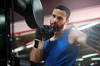 Buy stock photo Punch, sports or man with pads for boxing exercise, strong impact or self defense gym. Fist, athlete and boxer in practice for training technique, learning and fitness workout with fighting skills