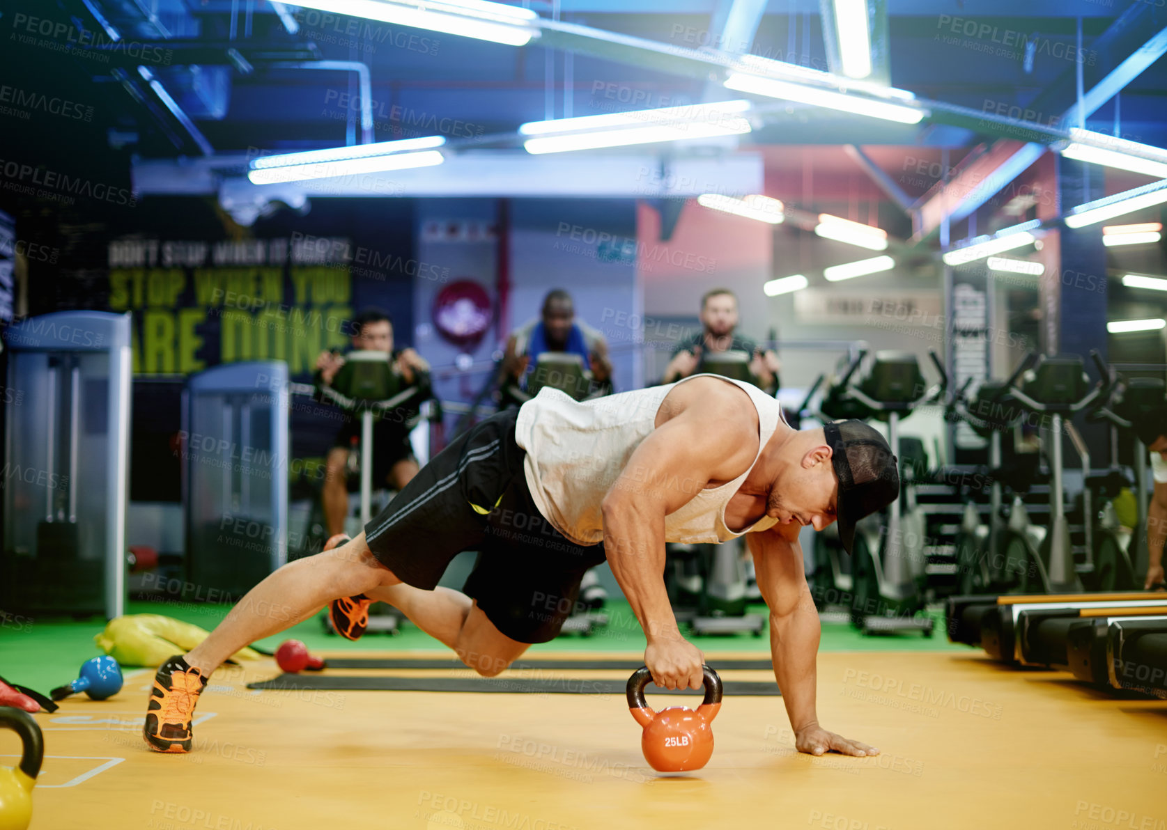 Buy stock photo Fitness, man and kettlebell plank in gym for core strength, weight training exercise and endurance. Balance, athlete and equipment at sports club for night workout, coordination or muscle development