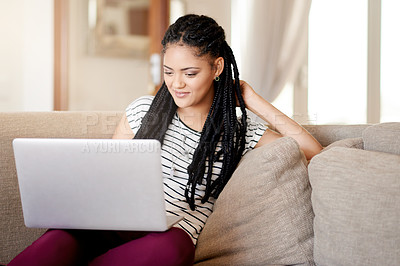 Buy stock photo Research, reading and laptop with student on sofa for scholarship application, smile and online course. College tuition, financial aid and University credits with woman in living room of home