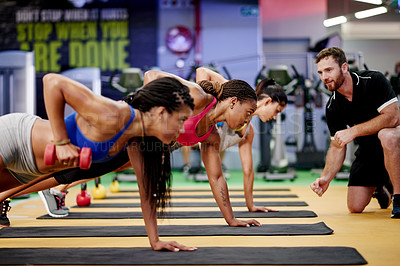 Buy stock photo Fitness, women and dumbbell in gym class for weightlifting, arm muscle development or exercise group. Bodybuilder, workout and personal trainer with weight for strength, commitment or sport activity