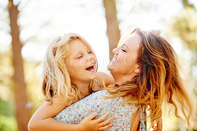 Buy stock photo Happy, mother and hug child at park for fun, playful games and bonding together on holiday getaway. Smile, woman and embrace kid with support, love and affection with daughter on vacation in nature