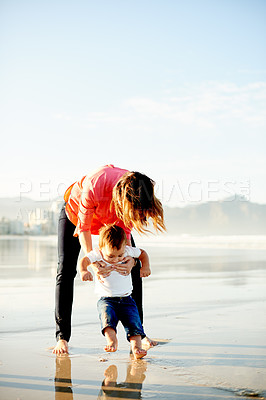Buy stock photo Happy, playing and mom with child at beach for bonding, summer vacation and holiday outdoor. Family, space and woman with kid by ocean for fun, adventure and playful relationship on weekend together