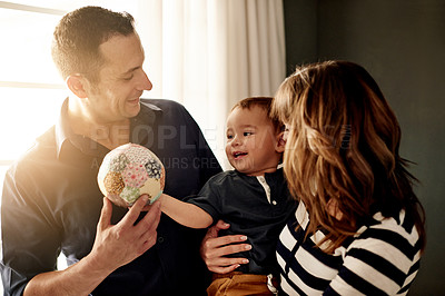 Buy stock photo Parents, happy or toddler playing with ball in family home to relax for support or bonding together. Smile, father or mom with boy child in house for relationship, growth development or love with toy