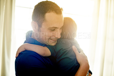 Buy stock photo Father, love and hug child in home for care, support and connection with happy parent. Dad, smile and embrace kid in house with toddler for bonding, trust and safety with family together on weekend