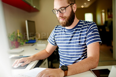 Buy stock photo Documents, laptop and reading with man in home office for remote work or small business startup. Computer, information and paperwork with freelance employee at desk in apartment for research