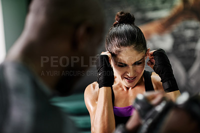 Buy stock photo Boxing, challenge and personal trainer with woman in gym for sparring partner, fitness or self defense. Martial arts, fight training or coaching with people in ring for punch, boxer and intense sport