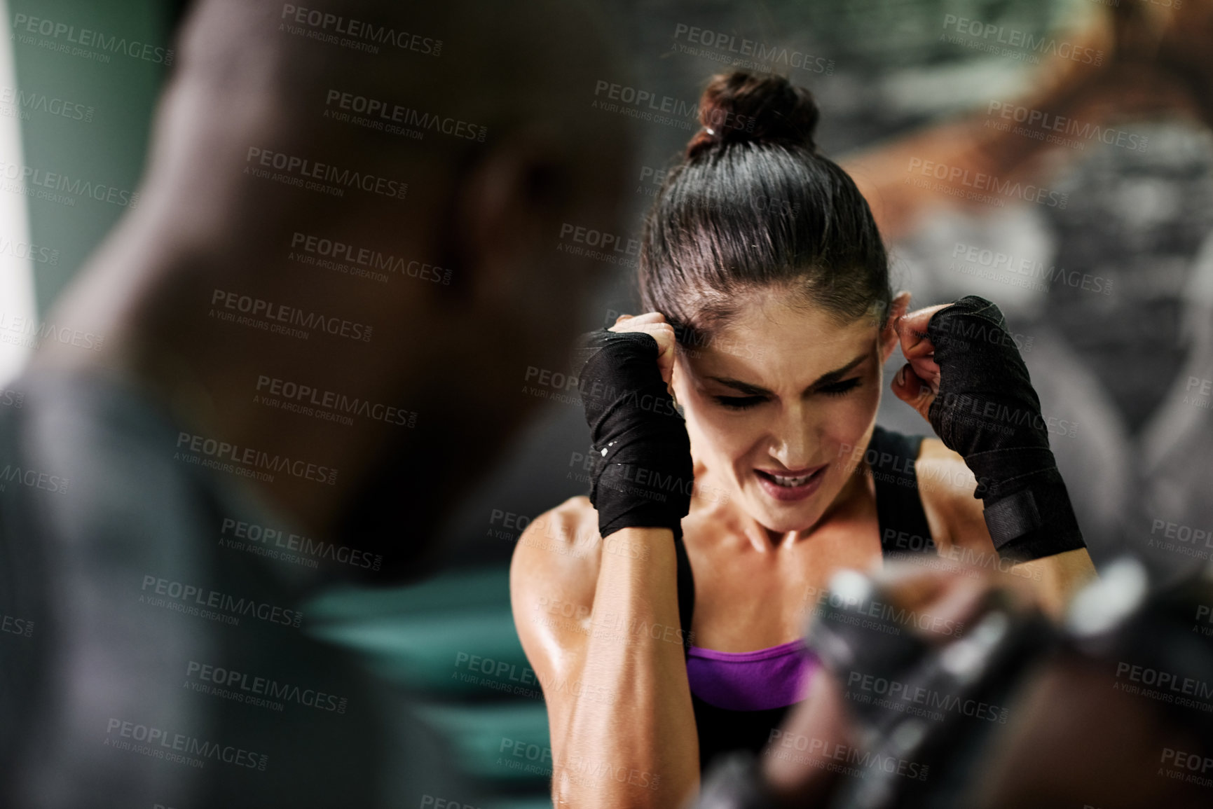 Buy stock photo Boxing, challenge and personal trainer with woman in gym for sparring partner, fitness or self defense. Martial arts, fight training or coaching with people in ring for punch, boxer and intense sport