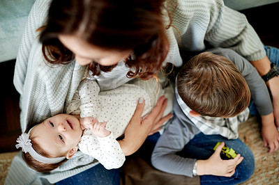 Buy stock photo Above, baby and kid with mom in living room for bonding, love or child development. Single parent, son and mother on floor in home with comfort, trust and relax for family support and relationship