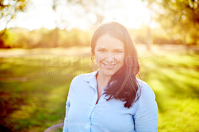 Buy stock photo Portrait, outdoor and woman in nature with smile, lens flare and fresh air in weekend break. Happiness, relax and female in garden area with positivity, good mood and peace on spring getaway. 