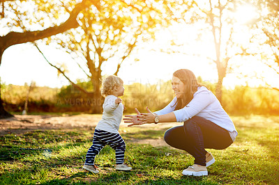 Buy stock photo Parent, smile and kid in park with play, bonding together and family time in summer adventure. Freedom, mother and daughter in grass field with fun, support or happy moment on spring afternoon.