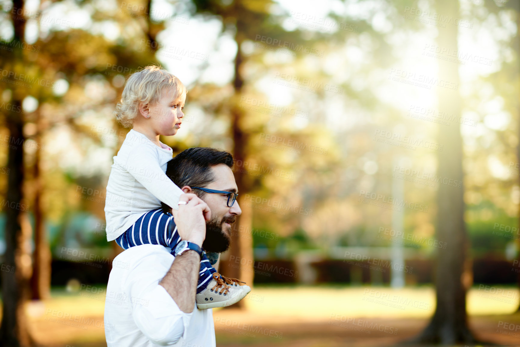 Buy stock photo Adventure, daughter on shoulders and father outdoor together for child development, growth or trip. Bokeh, bonding or walking with single parent man and toddler in nature for discovery with space