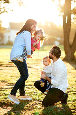 Buy stock photo Parents, kids and girls in park, love and bonding together with happiness, nature and fun. Outdoor, mother and father with children, development and playing with daughters, holiday and weekend break