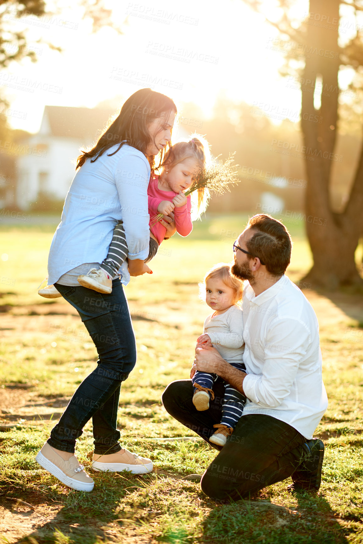 Buy stock photo Parents, kids and girls in park, love and bonding together with happiness, nature and fun. Outdoor, mother and father with children, development and playing with daughters, holiday and weekend break