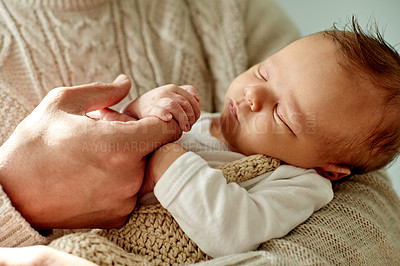 Buy stock photo Baby, parent and finger in hand for bonding, nap or newborn with love, moment and care. Peace, calm and relationship growth for family, sleepy infant in arms or people for new parenthood with safety