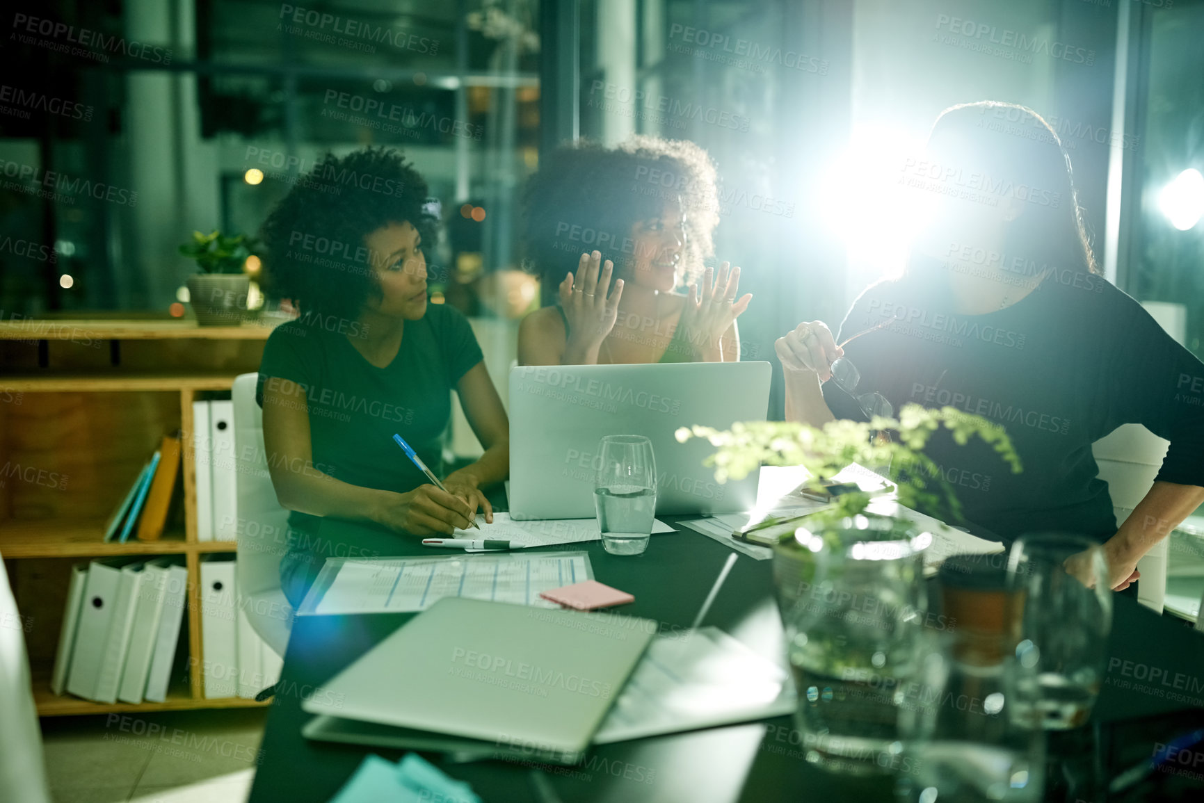 Buy stock photo Night, group and women with laptop, office or collaboration for marketing strategy or communication. Working late, colleagues and people with tech for deadline, ad campaign and flare in business