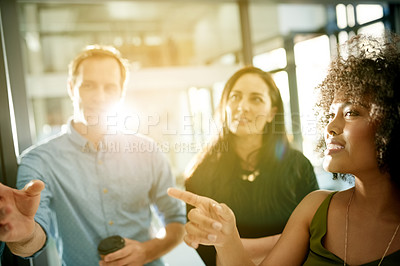 Buy stock photo Meeting, scrum and pointing with business people in office for teamwork, campaign progress and research. Planning, moodboard and project review with employees in agency for schedule and lens flare