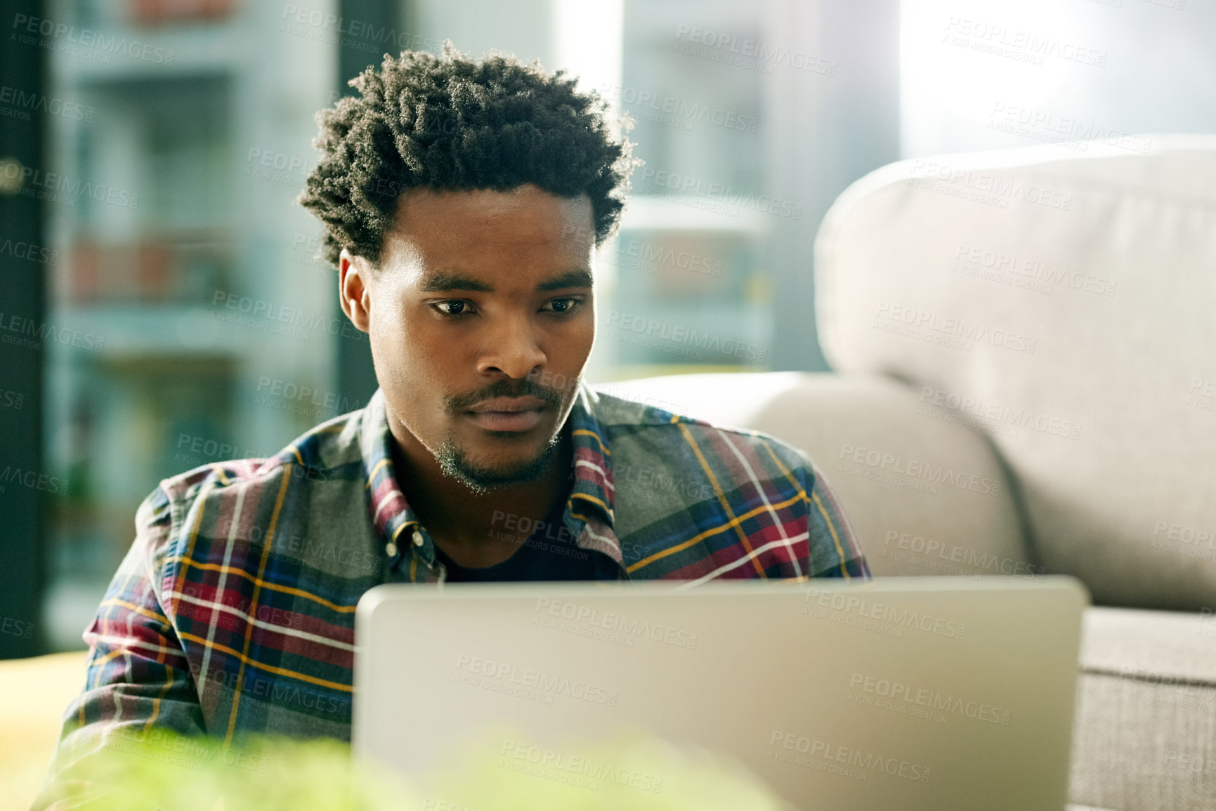 Buy stock photo Laptop, research and black man in home for remote work,  freelance and creative project in living room. Email, computer and African male copywriter with online article for publishing in apartment.