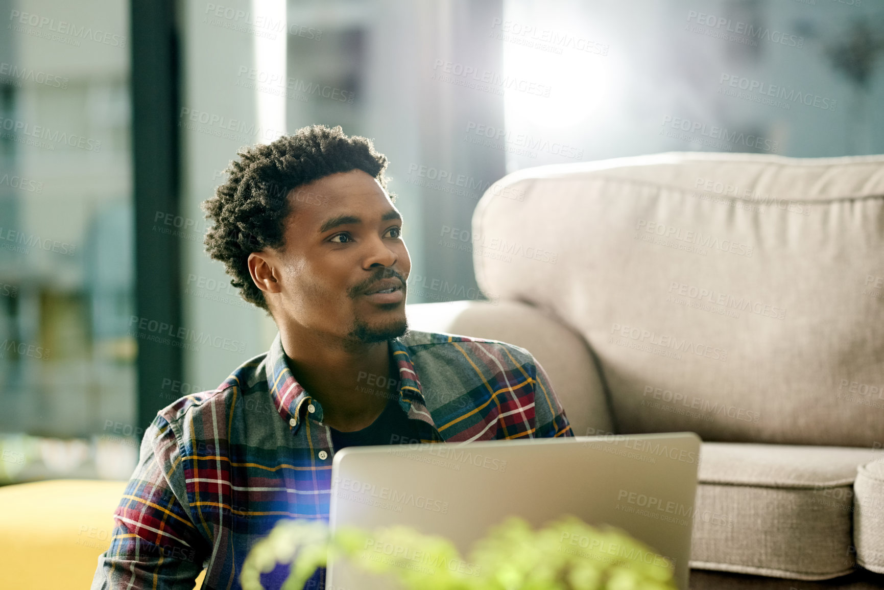 Buy stock photo Laptop, creative and black man in home for remote work, freelance project and research in living room. Email, computer and African male copywriter with online article for publishing in apartment.