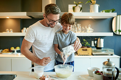 Buy stock photo Cooking, pancake and teaching with father and son in kitchen for learning, breakfast and support. Food, ingredients and batter with man and child with bowl in family home for help, bonding and love