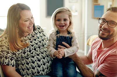 Buy stock photo Happy, parents and relax with kid at house for love, trust and bonding together with support. Portrait, people and child smile on sofa for security, care and family connection for affection in lounge
