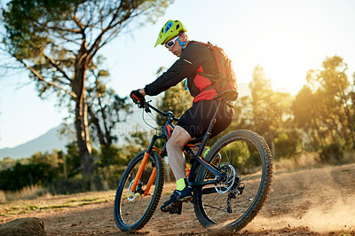 Buy stock photo Man, mountain bike or cycling with dust on dirt track for fitness, extreme sport or cardio workout in nature. Active, cyclist or riding with bicycle for training, adrenaline rush or outdoor exercise