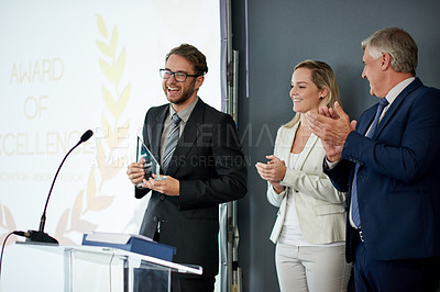 Buy stock photo Happy, businessman or applause with award on podium for congratulations or winning in workshop. Excited group, employee or team clapping with trophy for reward nomination or promotion in ceremony