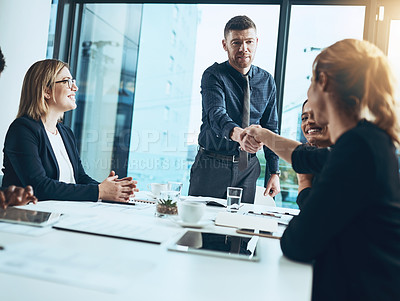 Buy stock photo Business people, meeting and handshake with agreement in office for partnership, launch or project. Deal, employees and shaking hands with smile for brainstorming, planning or proposal for feedback