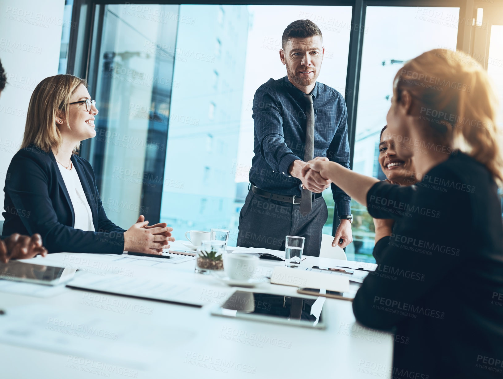 Buy stock photo Business people, meeting and handshake with agreement in office for partnership, launch or project. Deal, employees and shaking hands with smile for brainstorming, planning or proposal for feedback