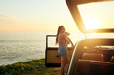 Buy stock photo Shot of a young woman on a roadtrip