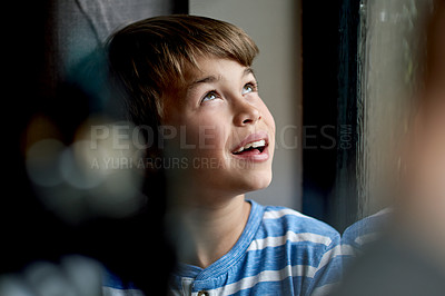 Buy stock photo House, window and boy with ideas, thinking and daydreaming with view, smile and happiness. Apartment, kid and child in lounge, wonder and ponder with thoughts, break and relax with comfort and choice