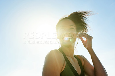 Buy stock photo Fitness, woman and happy with earphones outdoor for exercise podcast, cardio playlist and bokeh. Flare, smile and runner listening to training audio on mockup space for marathon practice and workout