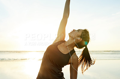 Buy stock photo Stretching, beach and woman with earphones, fitness and listening to podcast for exercise and summer. Outdoor, serious and streaming of audio for workout, sea and routine for person with music