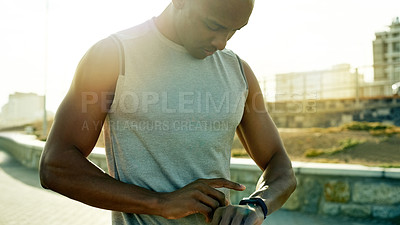 Buy stock photo Fitness, training and black man in city with smart watch, health and heart rate in urban town. Digital app, cardio and African athlete outdoor with tech, tracking and step counter with notification.