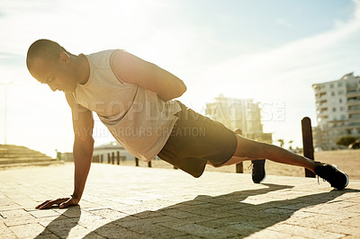 Buy stock photo Man, fitness and one arm pushup in city for exercise, workout and body weight training for health. Press up, sports and African athlete with strong muscle, calisthenics or balance with core stability