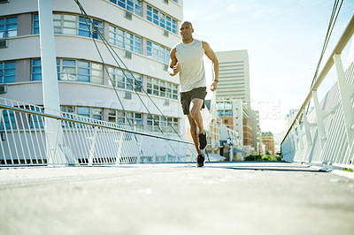 Buy stock photo Running, fitness and bridge with black man in city for cardio challenge, marathon practice and sports athlete. Workout, training and wellness with low angle of person outdoor for race and endurance