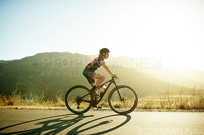 Buy stock photo Woman, bicycle and fitness with cycling outdoor, exercise and training for triathlon in nature. Person, cyclist or athlete with bike for ride in countryside, practice or prepare for health space