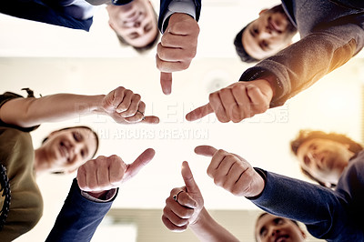 Buy stock photo Low angle, circle or business people with thumbs up in office for good job, well done or teamwork. Group, below and employees with smile, like gesture or yes sign for review and staff development