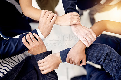 Buy stock photo Top view, holding arms and business people with support in office for solidarity or community. Above, link connection and employees with hands together for collaboration, teamwork or company growth 