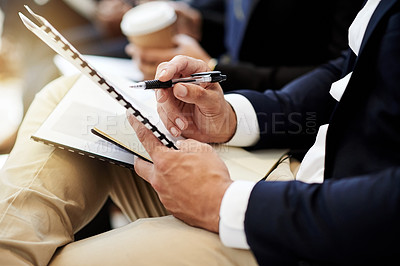 Buy stock photo Hands, person and reading document in meeting for schedule update, conference agenda and proposal. Man, audience and paperwork for business training, seminar presentation and information at workshop