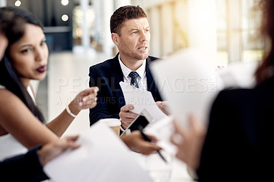 Buy stock photo Frustrated, businessman and meeting with documents for financial crisis or bankruptcy in office. Man, employee or upset with team or paperwork for debt review, company expenses or finance proposal