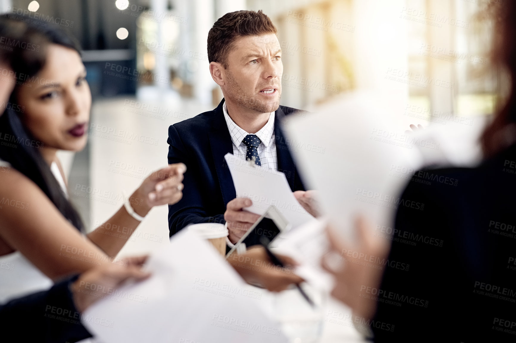 Buy stock photo Frustrated, businessman and meeting with documents for financial crisis or bankruptcy in office. Man, employee or upset with team or paperwork for debt review, company expenses or finance proposal