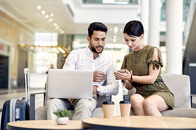 Buy stock photo Laptop, phone and business people in airport lobby for conference, travel and email confirmation. Online booking, seminar schedule and luggage with man, woman and tech for reservation information