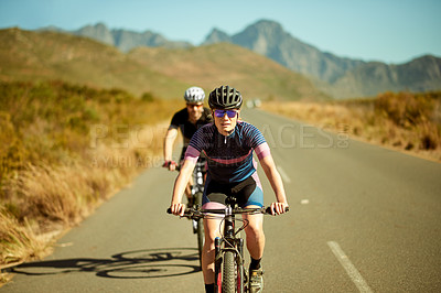 Buy stock photo Fitness, woman and couple with bicycle outdoor for sports, exercise or workout together. Bike, man and partner on road for training, cardio challenge or cycling with balance for health in countryside