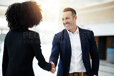 Buy stock photo Happy, meeting and business people with handshake in office for introduction, collaboration and networking. Corporate, lobby and man and woman shaking hands for agreement, B2B partnership and welcome