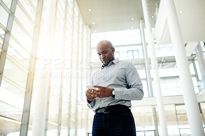 Buy stock photo Man, phone and texting for real estate deal in lobby, low angle or contact for negotiation. Person, realtor and smartphone with app for property investing, notification or proposal for building sale