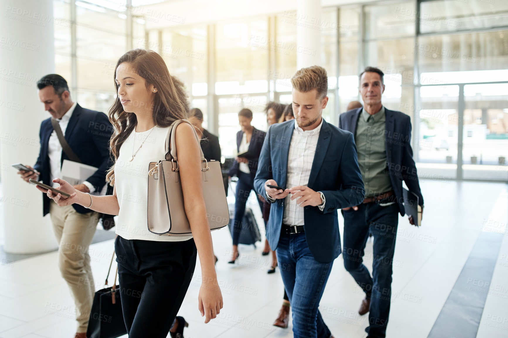 Buy stock photo Business people, walking or travel agency with group in corporate building for company immigration. Team, staff or employees moving together with luggage for new career, job opportunity or relocation